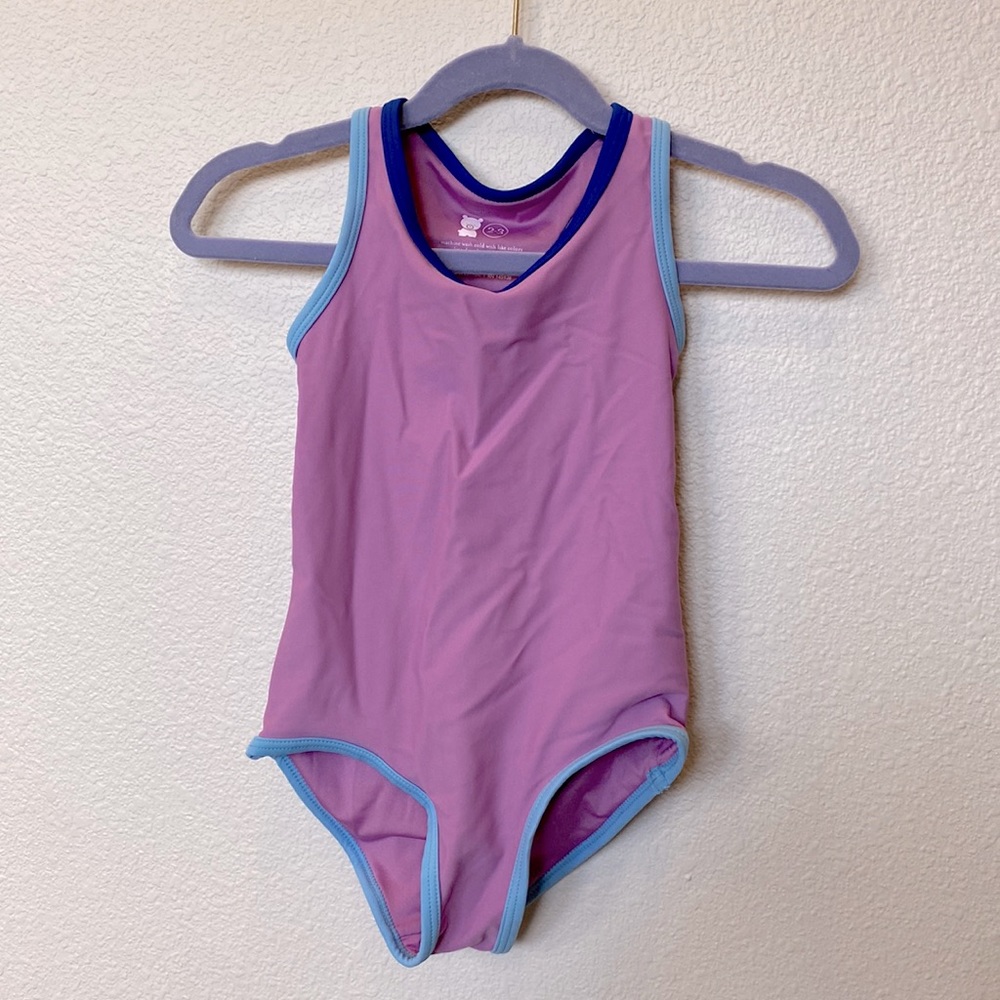 Primary clothing girls one piece bathing suit. Never worn. Size 2-3 years.